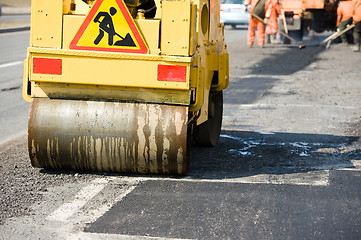 Image showing Asphalt paving works with compactor