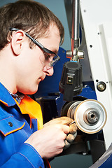Image showing worker at machine tool operating