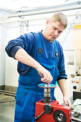 Image showing worker installing cutting tool