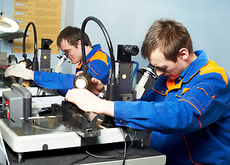 Image showing two workers at tool workshop