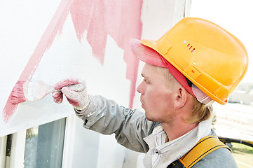 Image showing builder facade painter at work