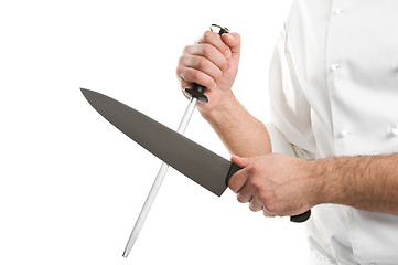 Image showing chef hands with knife sharpen steel tool isolated