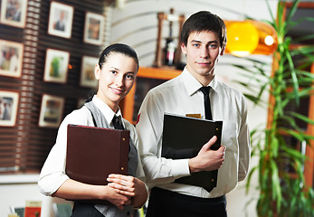 Image showing Waitress girl and waiter man in restaurant