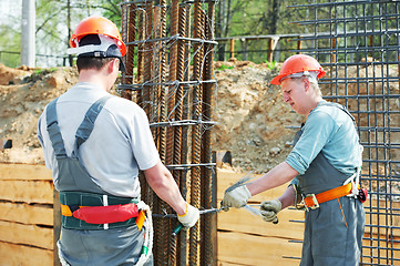 Image showing construction workers making reinforcement