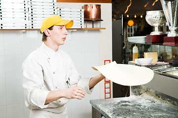 Image showing Pizza baker juggling with dough