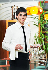 Image showing waiter in uniform at restaurant