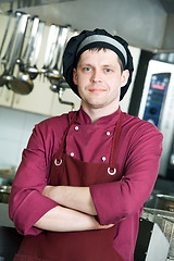 Image showing chef in uniform at kitchen