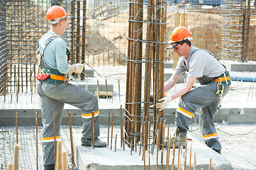 Image showing construction workers making reinforcement