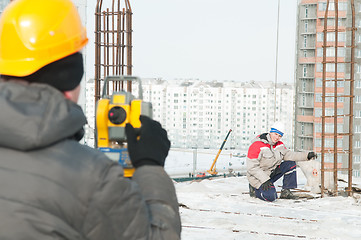 Image showing Surveying works at construction site