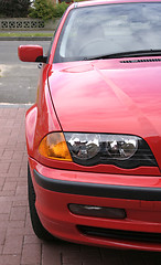 Image showing red car wing and headlights