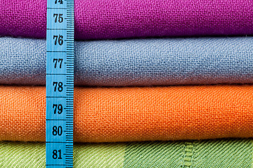Image showing Colorful cotton cloth with measuring tape