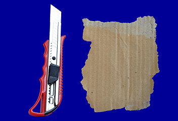 Image showing Paper knife and old cardboard