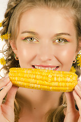 Image showing woman eating corn-cob