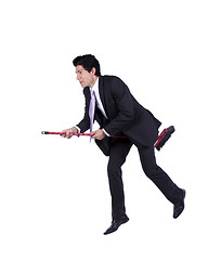 Image showing Businessman flying a broom