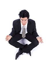 Image showing Businessman making yoga