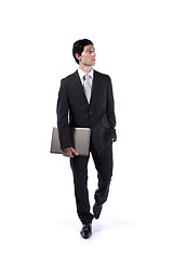 Image showing Businessman walking and looking up