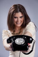 Image showing Sexy woman holding a telephone