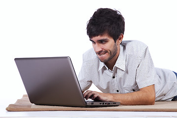 Image showing Happy young man surfing the internet