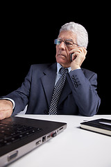 Image showing Senior Businessman talking at the cellphone