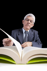 Image showing Senior businessman reading a book