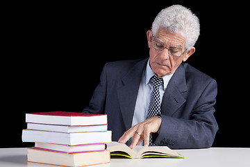 Image showing Senior teacher reading Books