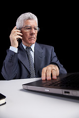 Image showing Senior Businessman talking at the cellphone