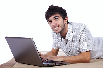 Image showing Happy young man surfing the internet