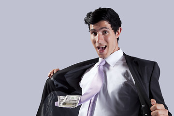 Image showing Businessman with a flying necktie with money