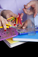 Image showing Hands holding education objects