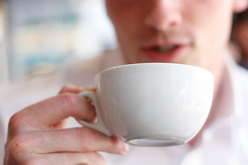 Image showing Drinking coffee