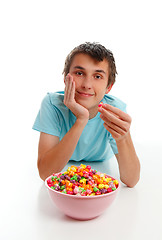 Image showing Boy relaxing with bowl popcorn