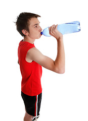 Image showing Teenager drinking bottled water