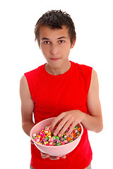 Image showing Boy with a bowl of candied popcorn