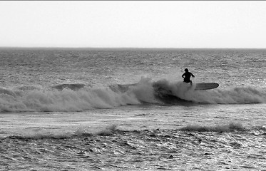 Image showing Surfing on a sun down