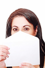 Image showing woman covering her face with a letter isolated 