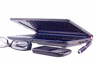 Image showing Cell phone, laptop, sunglasses and pen isolated