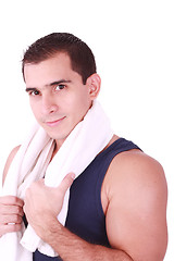 Image showing A young man just finishes his workout and with towel over his shoulder 