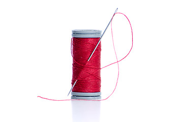 Image showing Red thread bobbin and needle 