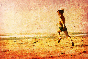 Image showing Child running on a beach