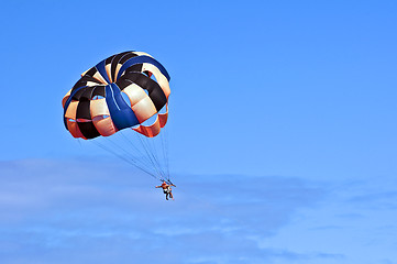 Image showing Parasailing under blue sky.