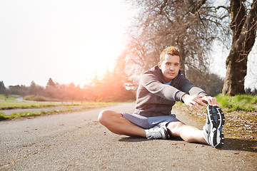 Image showing Mixed race man stretching