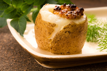 Image showing Baked potato with sour cream, grain Dijon mustard and herbs