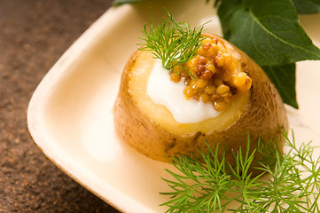 Image showing Baked potato with sour cream, grain Dijon mustard and herbs