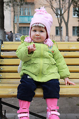 Image showing girl sits on a bench