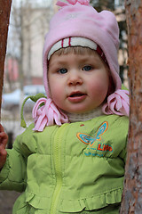 Image showing girl hides behind a tree