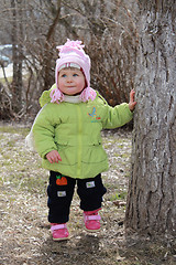 Image showing girl hides behind a tree