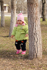 Image showing child plays hide-and-seek