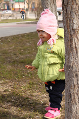 Image showing child plays hide-and-seek