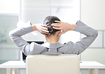 Image showing businesswoman resting in the arm-chair  