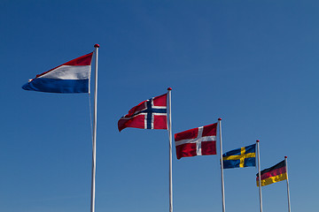 Image showing Flags on a blue sky